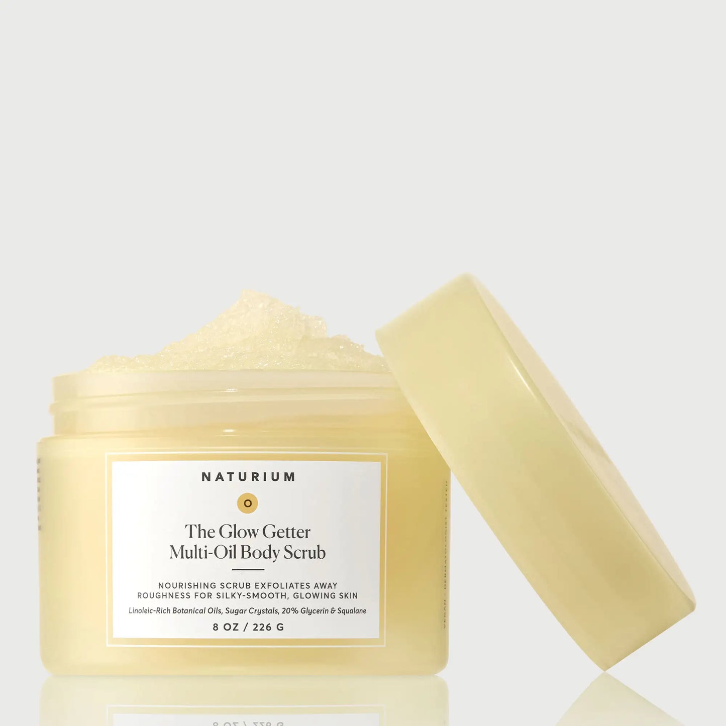 the-glow-getter-multi-oil-body-scrub-t1 NATR-40028-GlowGetter-Multi-Oil-Body-Scrub-Front-CapOff-bonebkgd.webp