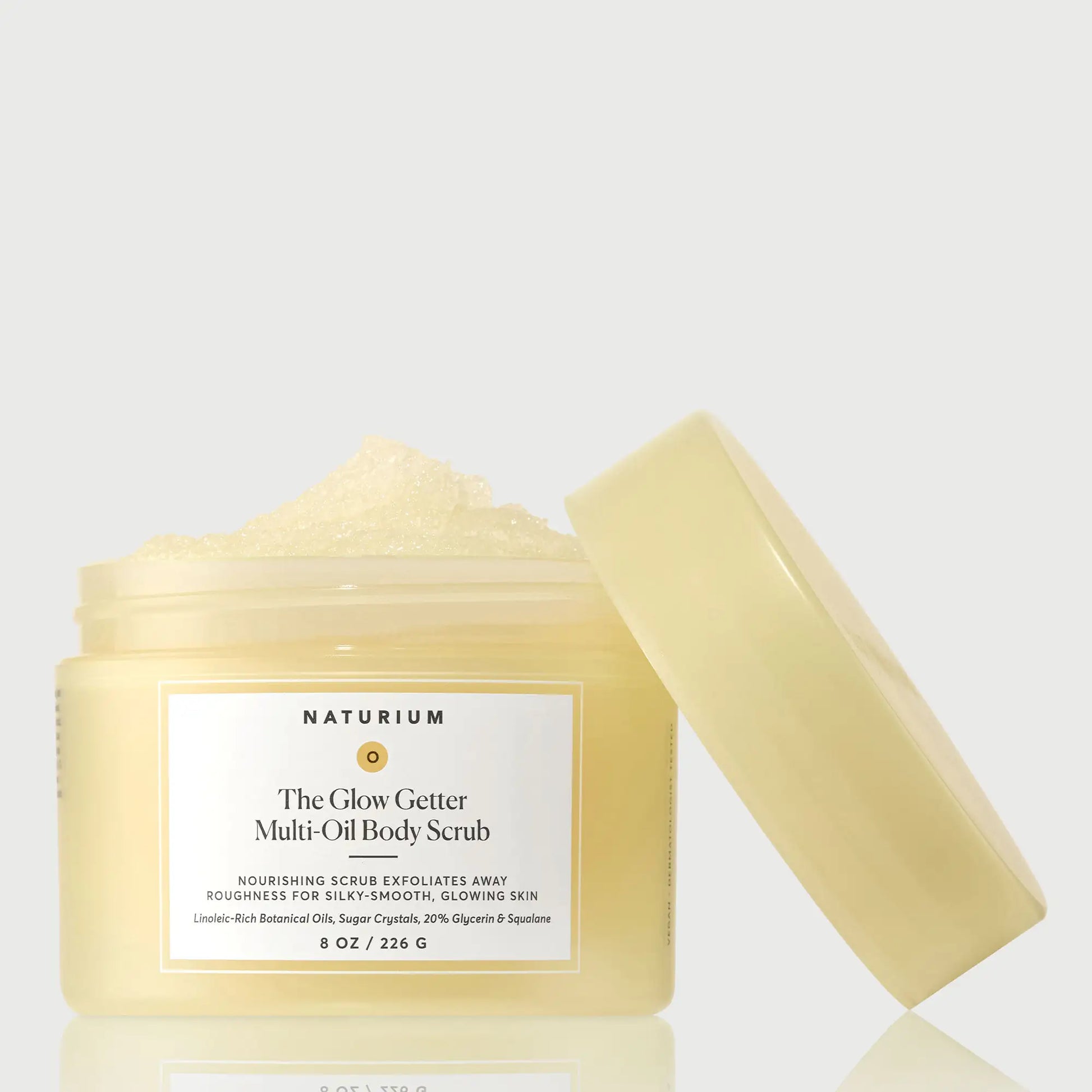 the-glow-getter-multi-oil-body-scrub-t1 NATR-40028-GlowGetter-Multi-Oil-Body-Scrub-Front-CapOff-bonebkgd.webp
